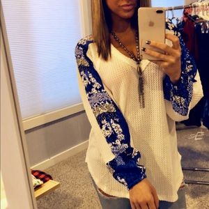 Waffle knit top with fabric sleeves